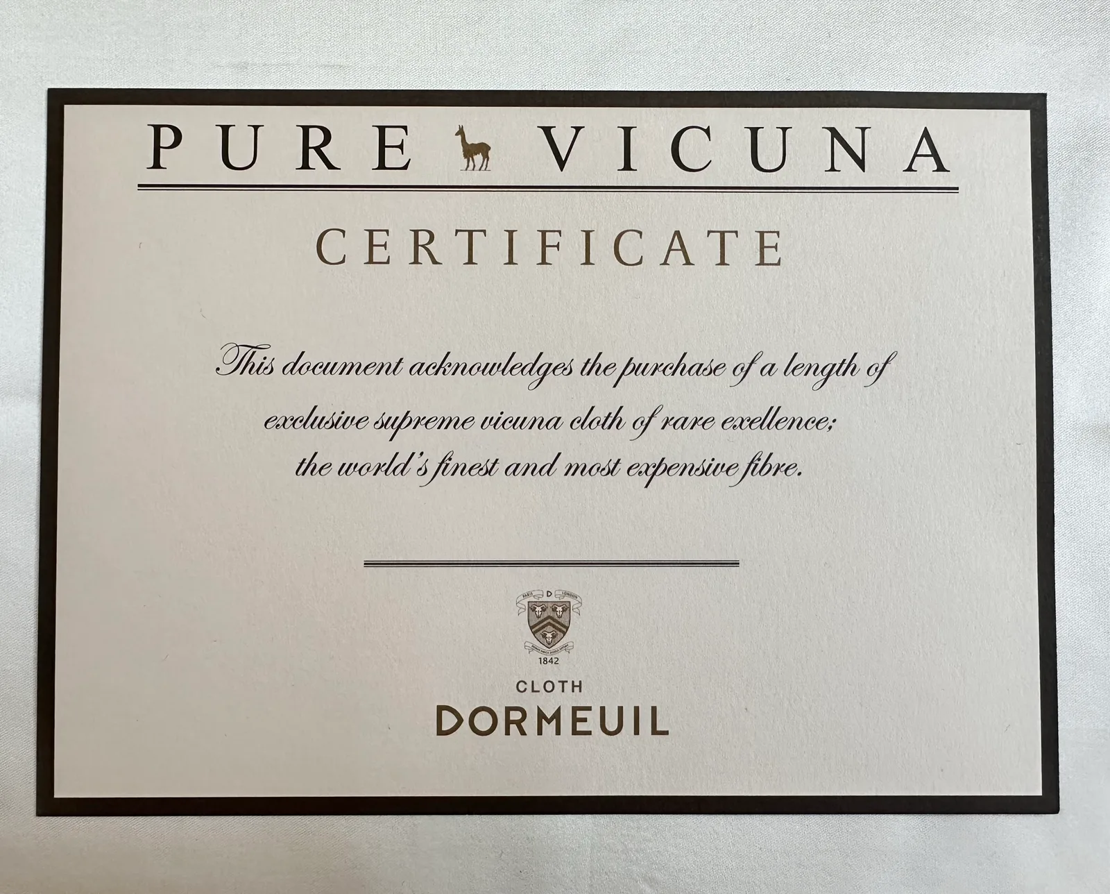 A Dormeuil certificate identifies the rare pure vicuña cloth used for the jacket.