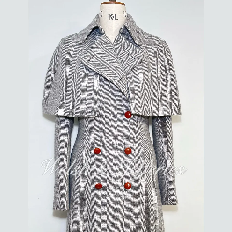View with matching cape of the pale-grey herringbone cape overcoat.