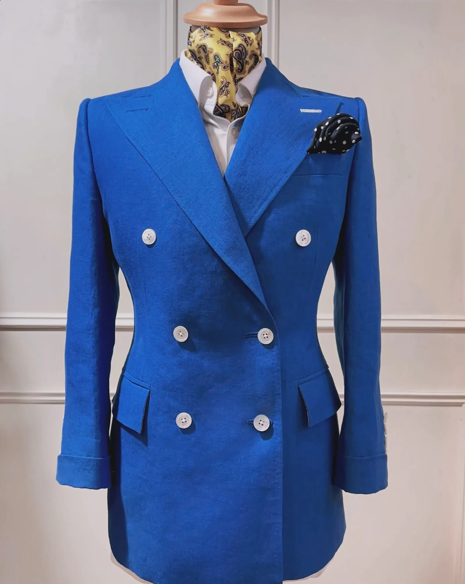 Front view of electric-blue double-breasted ladies' three-piece suit.