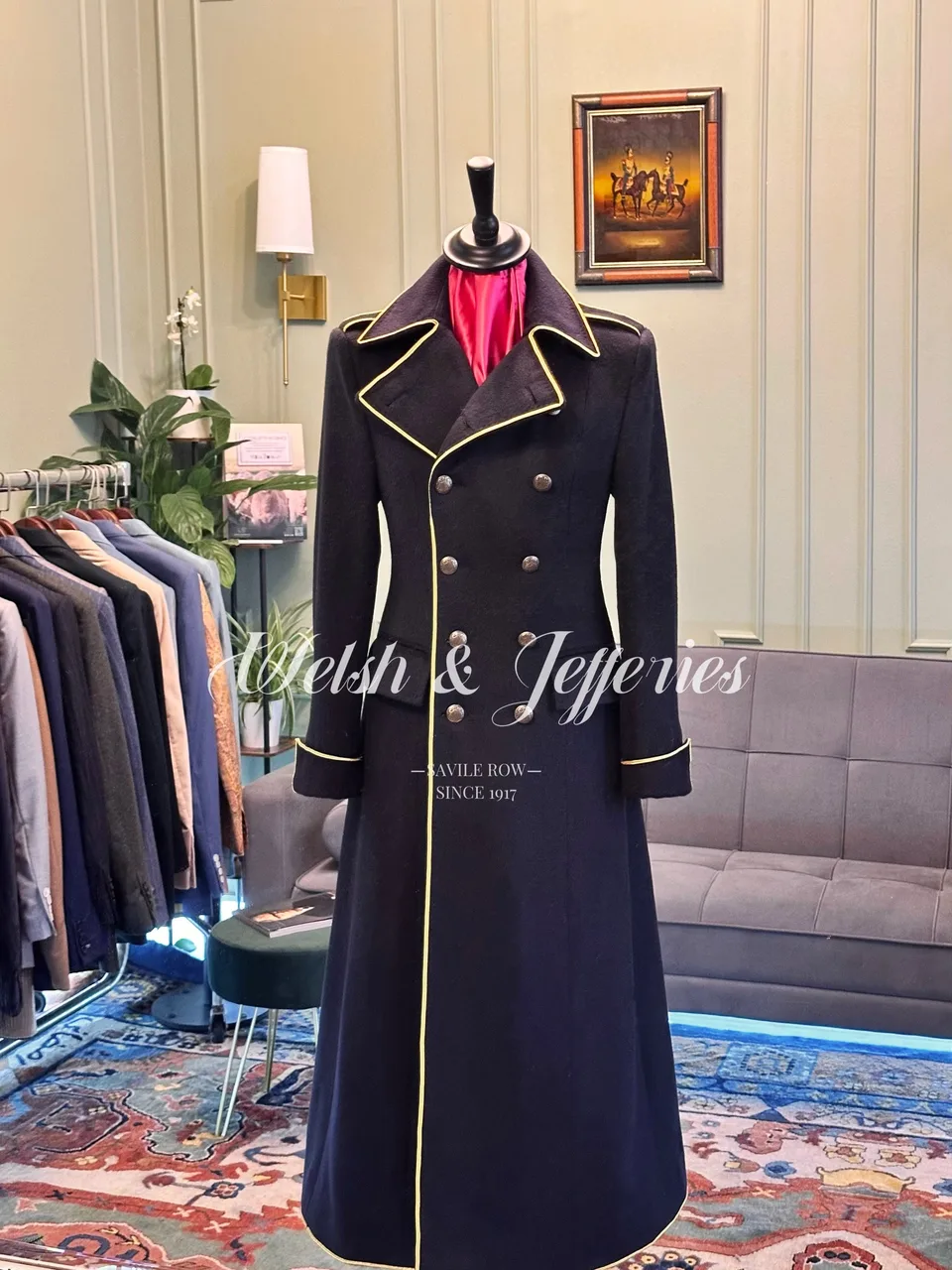Front view of deep navy military coat with gold piping.
