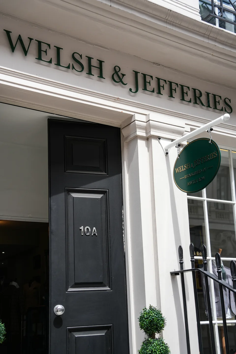 Welsh & Jefferies signage above the black door at 10A Charles II Street.