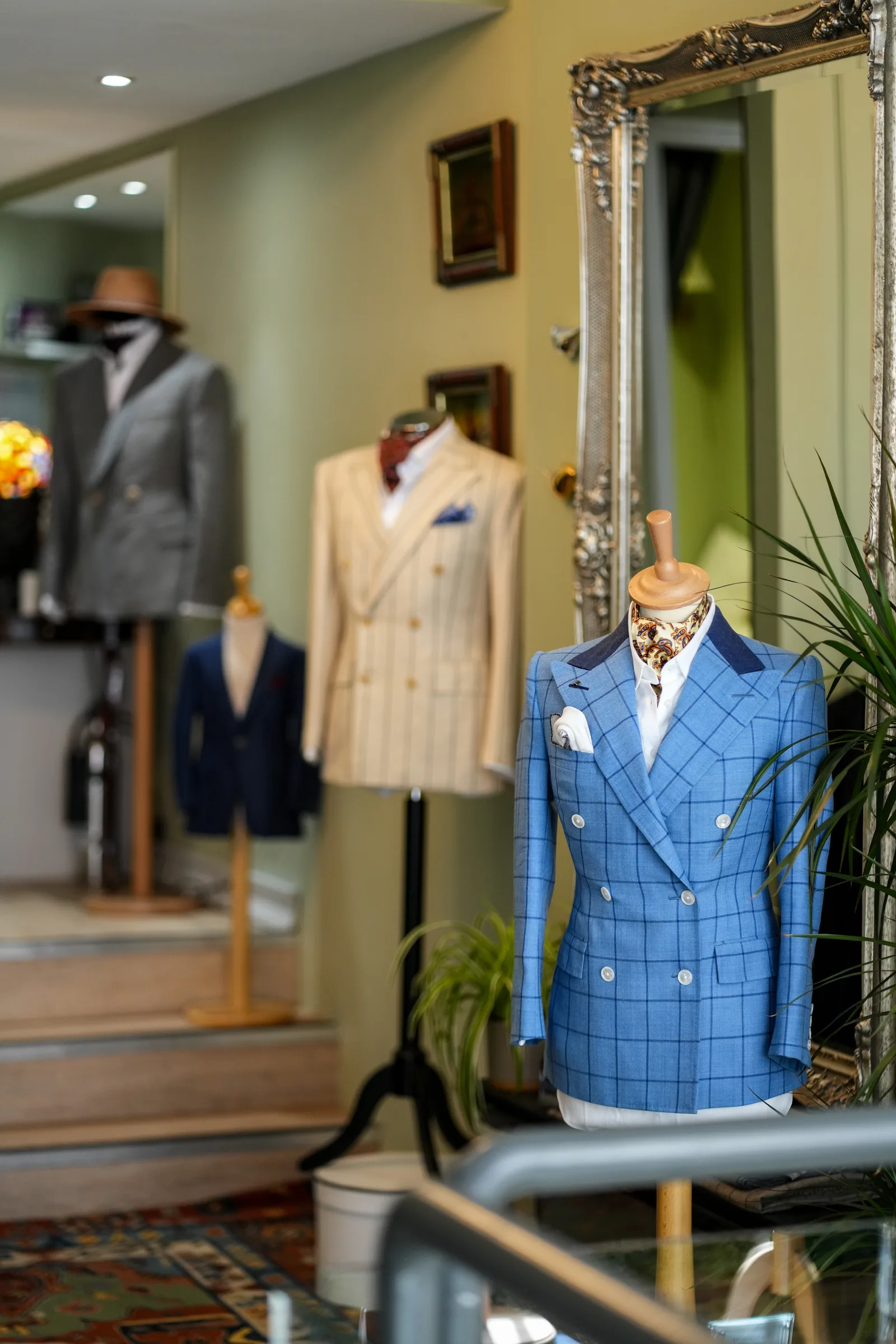 Blue checked tailoring in the foreground of the elegant showroom