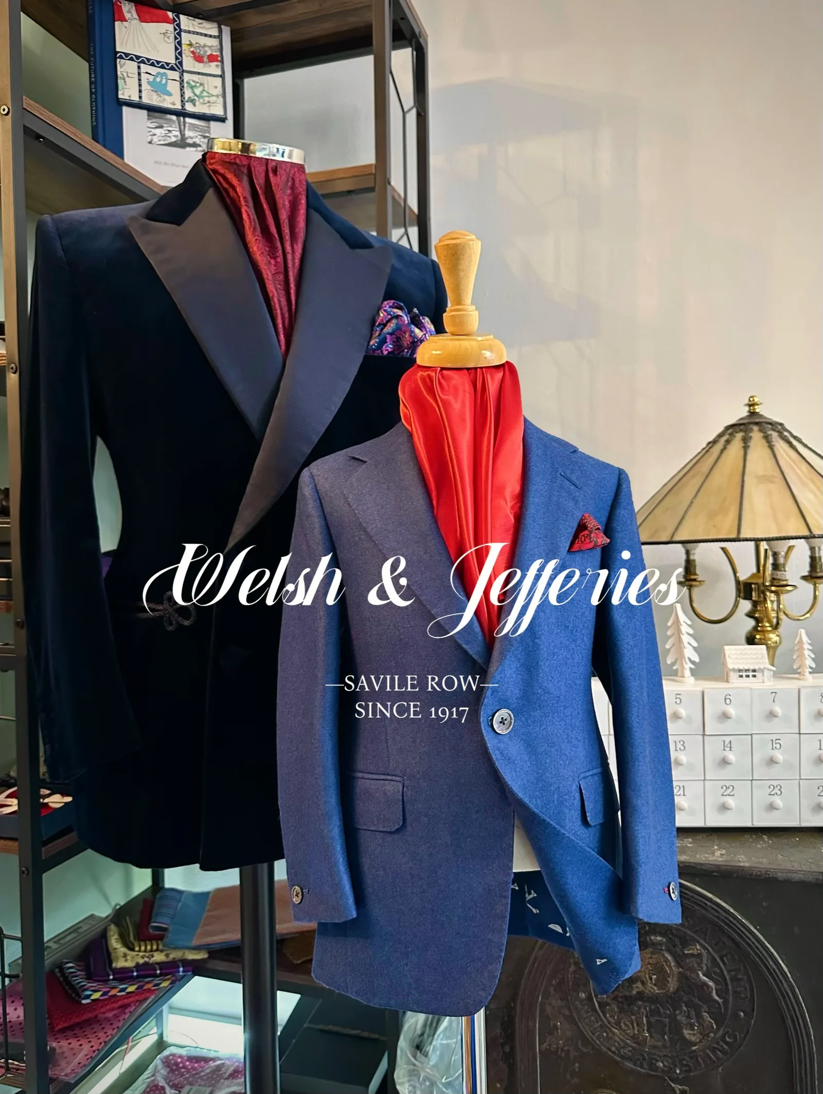 Shop display featuring a midnight velvet double-breasted evening jacket with frog closures