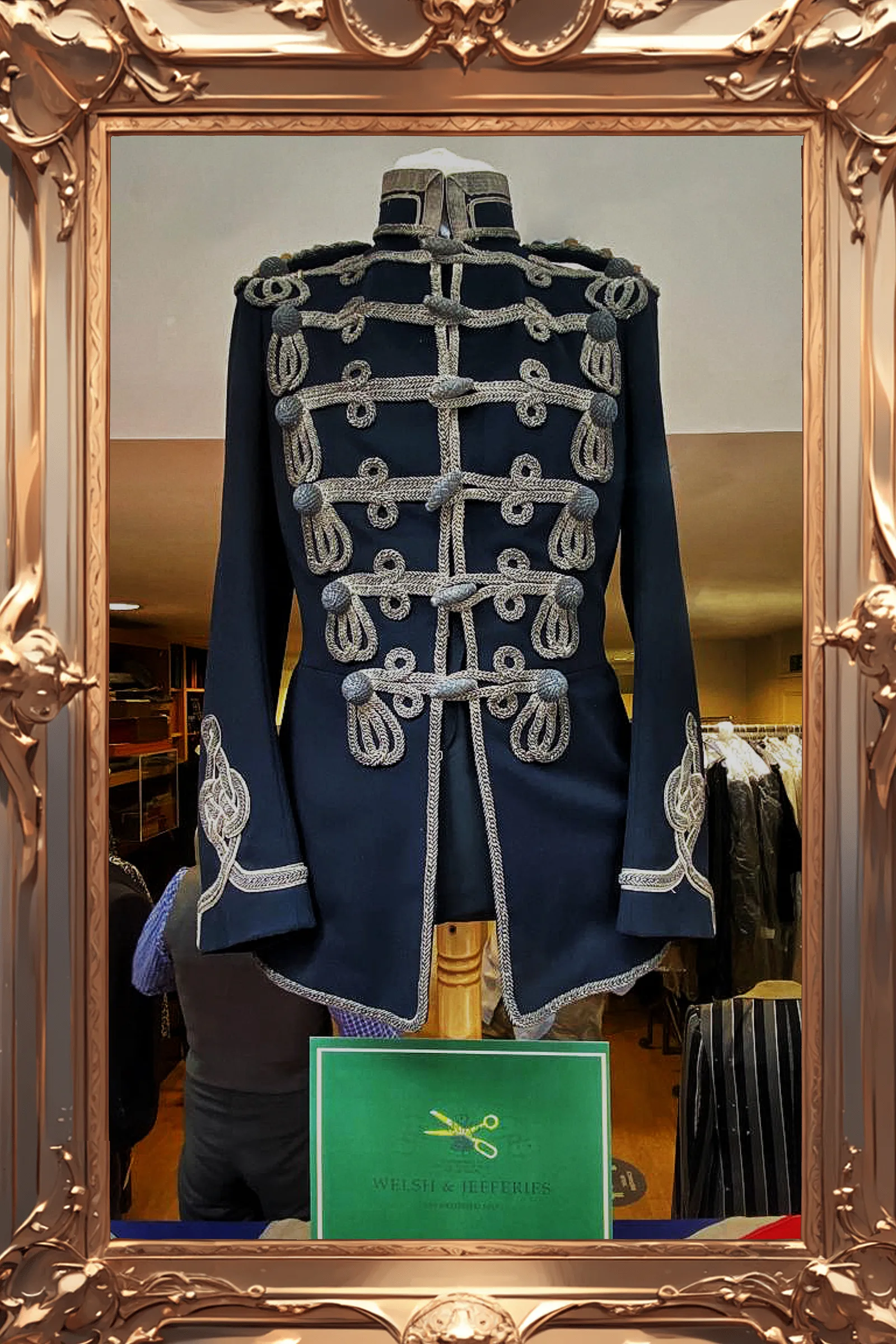 Midnight hussar tunic covered in six rows of silver frogging and trefoil cuff embroidery.